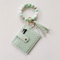 Detail of mint green silicone beaded bracelet with tassel keychain and woven card holder - Mint Green Woven Card Holder with Mint Green White Beads