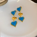 Vintage heart earrings in blue and gold finish featuring a triple heart drop design - Blue Gold Heart Stud Earrings