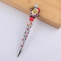 Detail of Christmas Santa bead pen featuring SpongeBob figurine with holiday bells and patterns - Yellow Sea Sponge
