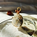 Handmade 18K gold wire-wrapped pendant with natural white and black spotted crystal stone - Gold Wire Moonstone
