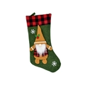 Detailed view of Christmas gnome stocking with buffalo plaid cuff and snowflake appliques - Green