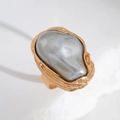 Baroque irregular grey pearl ring with textured gold metal band on a white stone base - Grey Artificial Pearl Ring