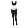 Detail van een zwarte yogaset met witte gekruiste elastische banden in de taille en buste - S / Zwart
