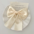 Elegant beige satin butterfly hair claw clip displayed on a white shell decorative tray - White Satin Bow Hair Clip / White