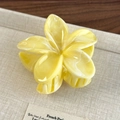 Elegant yellow marble plumeria hair claw clip with a glossy floral resin finish - Yellow