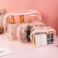 Three-piece set of transparent waterproof PVC toiletry bags with pink trim and zippers - Pink
