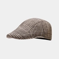 Close-up van de bruine geruite wollen stoftextuur en stiksels van de klassieke platte pet - Khaki / Eén maat