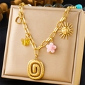 Detailed view of chunky gold chain necklace with sun, heart and star charms on display - Sun Butterfly Heart Disc (N3167)