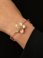 Chic gold flower bracelet with crinkled texture on wrist for elegant women - Gold Flower Bracelet (DZ-384)