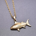 Detail of 18k gold plated fish pendant on an O-chain necklace over a textured background - Gold Color + Necklace Chain