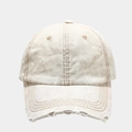 Close-up of distressed washed beige baseball cap featuring ripped edges and vintage canvas - Adjustable / Beige
