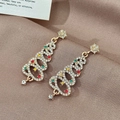 Golden Christmas tree earrings with colorful rhinestones on brown silk fabric - Gold Red Green Zirconia