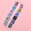 12-grid box of multi-colored flower nail art charms in diverse vibrant floral shades - 12 Colors Plum Flower Rhinestones