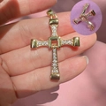 Close-up of a gold cross pendant with cubic zirconia and folding mechanism detail - Foldable Cross / Gold