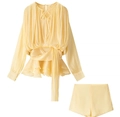 Detail of light yellow ruched long-sleeve top and matching shorts with tie neckline - Yellow Set