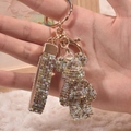 Sparkling champagne gold teddy bear keychain with rhinestone lanyard and golden hardware - Mixed Coffee