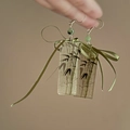 Detail of bamboo pattern earrings with green beads and silk ribbon bows on silver hooks - Hook Style / Green