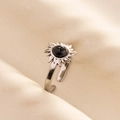 Macro detail of silver sunflower ring featuring a black cracked stone and adjustable band - Silver-Black Marble