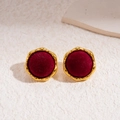 Close-up of vintage gold wavy edged round earrings with deep red flocked texture detail - Silver Earring Post - Red - Round