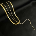 Double-layered 18K gold plated heart necklace set on elegant black silk background - Tassel Layered Necklace / Gold