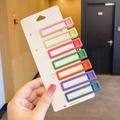 Seven-piece macaron color matte hair clip set on heart card held by hand - Long Bar 7-Color Set