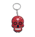 Detail of Day of the Dead red skull keychain with rose floral patterns and metal ring - Style G