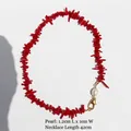 Irregular red coral branch necklace with white freshwater pearl and gold clasp - Necklace