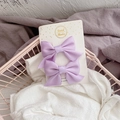 Close-up of two handmade purple fabric bow hair clips on a white display card - 2 Pcs/Set / Purple