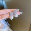 Close-up of elegant square diamond and pearl drop earrings held by hand - Silver Square Pearl Earrings (28#)