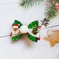 Détail de la pince à cheveux avec nœud de Noël pailleté vert et motifs de fête - Noeud Arbre de Noël
