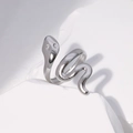 Macro detail of silver snake ring with spiral design on a minimalist stone pedestal - Steel Color Minimalist Spiral Style (JR129)