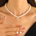 Elegant pearl jewelry set featuring a gold heart pendant necklace and drop earrings - KC Gold (11931)