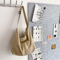 Minimalist beige corduroy hobo bag with large capacity and adjustable strap on a hook - Off White