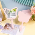 Pink butterfly shaped hand mirror with ergonomic handle and macaron candy color finish - Pink