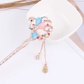 Peacock hair stick with blue gemstones and hanging tassel in a gold finish - Gold Peacock Colorful Gem Tassel (FZ040)