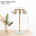 Golden rotating jewelry rack with glass base for necklaces and earrings display - Crystal Base Jewelry Rack - Irregular Gold