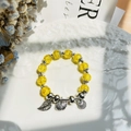 Exquisite beaded bracelet with yellow beads, leaf and heart charms on a ceramic plate - S056-yellow Shell Leaf Safety Buckle Bracelet #sz466