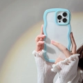 Detail of blue wave-shaped frame phone case with a clear backplate for iPhone - iPhone 14 Pro Max / Sky Blue