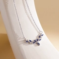 Silver antler necklace with blue marquise stones and white diamonds on white display - XL1998 Deer Horn V-Shape Blue Zircon Silver