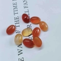 Detailed view of polished oval carnelian and agate loose stones for jewelry making - 6*8mm / Red Agate