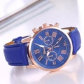 Detailed close-up of Geneva quartz watch showing navy leather strap and rose gold bezel - Blue