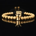 Bracciale a corona in acciaio al titanio dorato con corda nera regolabile - Corona d'Oro 6 Perline Ananas