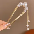 U-shaped gold hair pin with elegant white pearls and a delicate tassel chain for buns - Golden Lucky Cloud Pearl Tassel