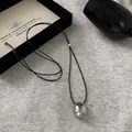 Minimalist wax cord necklace with oval silver pendant, adjustable 106cm length design - Silver Oval Irregular Polished