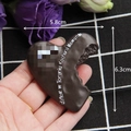 Macro shot of a chocolate heart magnet with bite mark and text for home decoration - Without Magnet / Bitten Heart Chocolate