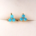 Bohemian gold stud earrings with three-stone turquoise cluster in a beige jewelry box - Lake Blue