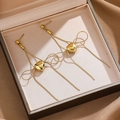 Elegante vergoldete lange Quastenohrringe mit Herz und Schleifenanhänger Design - Gold