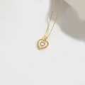 Golden necklace featuring a heart pendant with white shell inlay and zircon border - Layered White Zirconia Heart