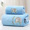 Detail of light blue coral fleece towel set featuring soft texture and moon rabbit embroidery - Moon Rabbit Aqua Blue