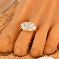 Golden toe ring with white shell fan design worn on beach sand for summer style - White Shell (12431)